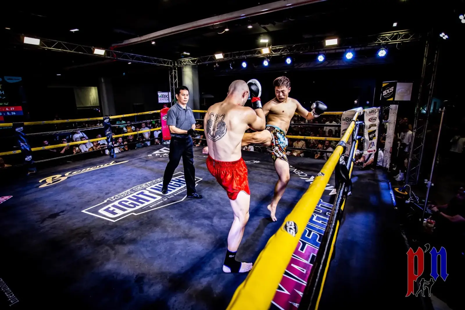 MBK Fight Night ring with fighters and a crowd