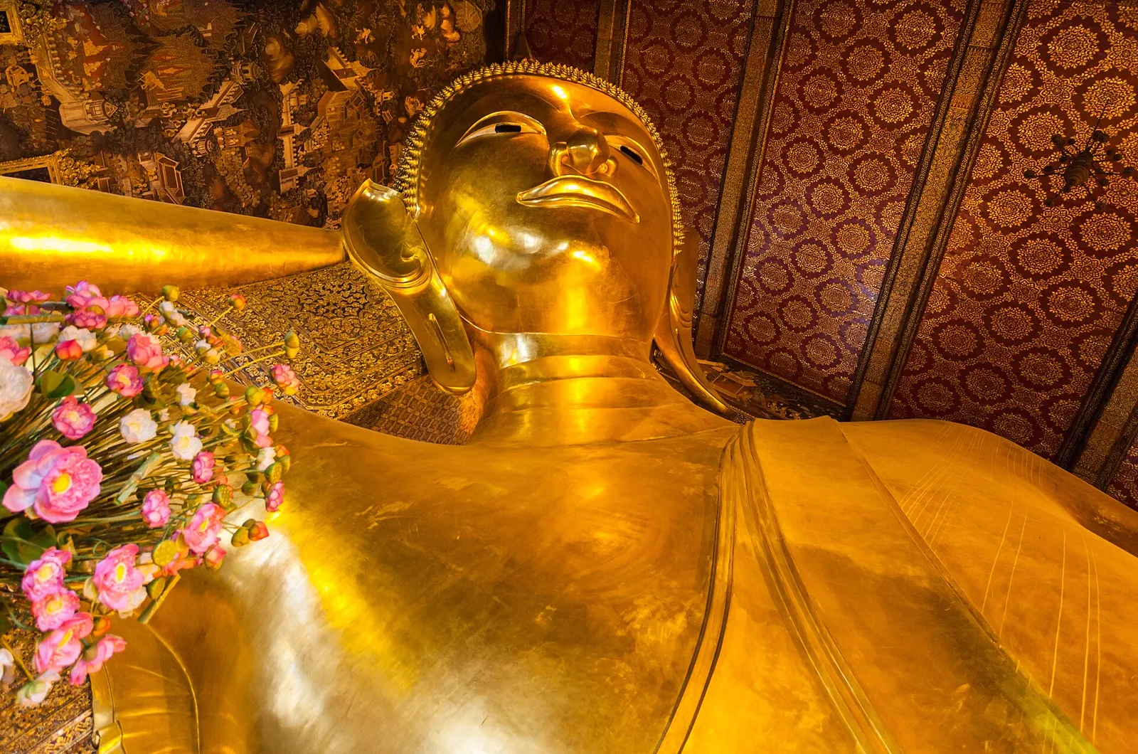 The giant golden Reclining Buddha inside Wat Pho in Bangkok